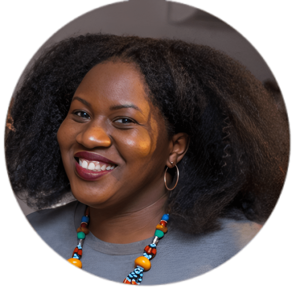Happy woman with vibrant beaded necklace.