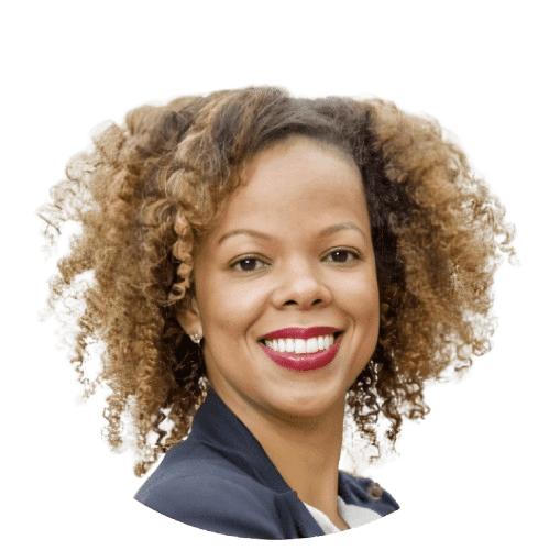 Portrait of a smiling woman with curly hair.